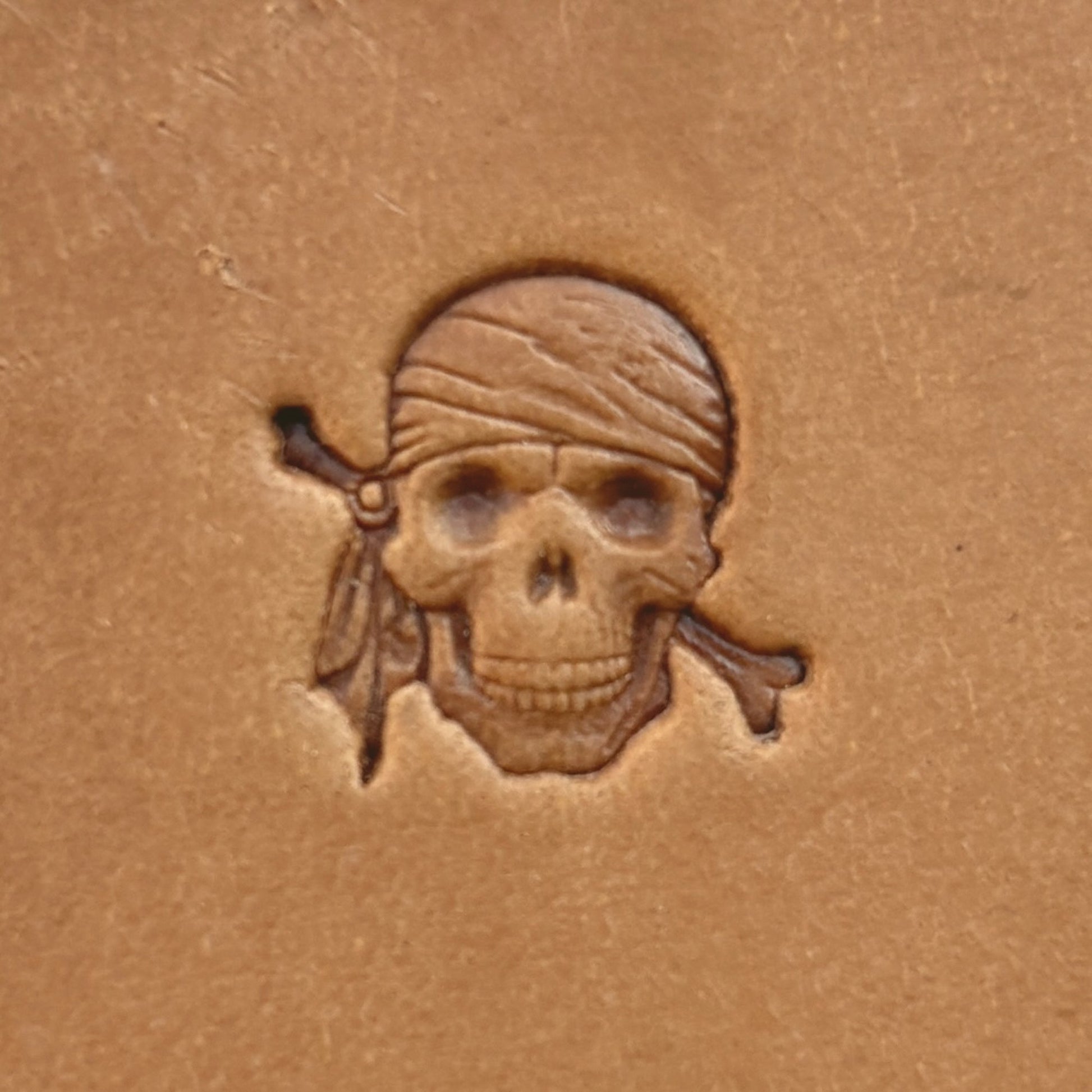 Pirate Skull leather stamp LT551 — single impression on veg-tan leather