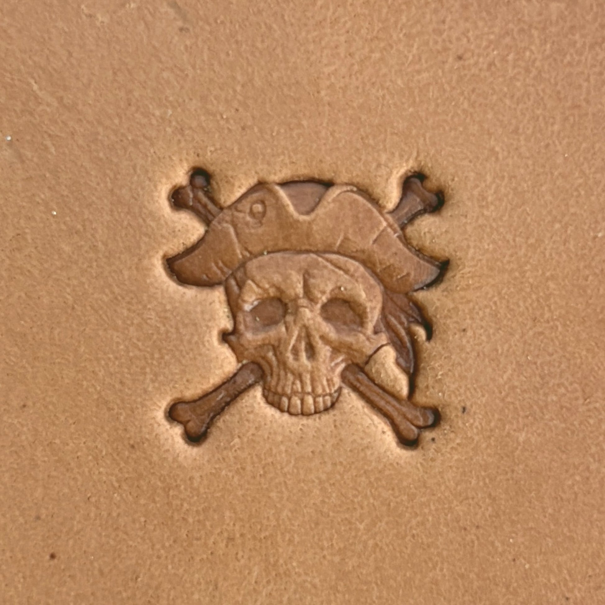 Pirate Crossbones Skull leather stamp LT557 — single impression on veg-tan leather
