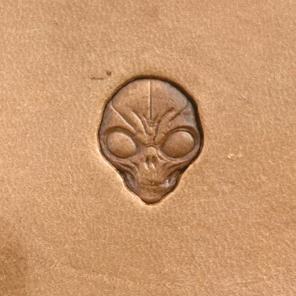 Alien Head Skull leather stamp LT569 — single impression on veg-tan leather