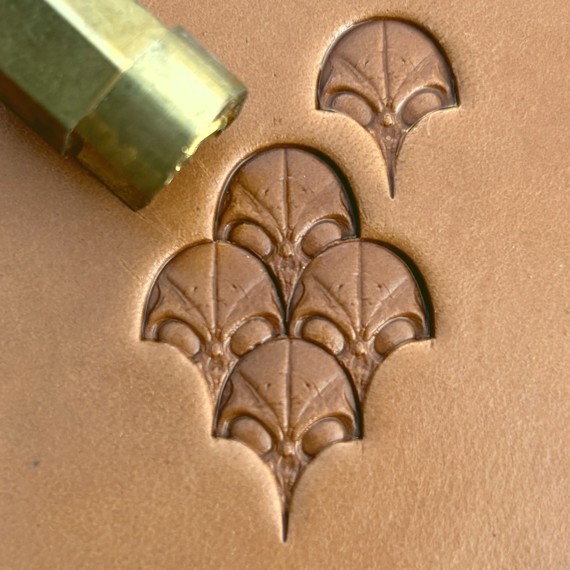 Alien Head leather stamp LT570 — brass stamping tool with imprint on natural veg-tan leather