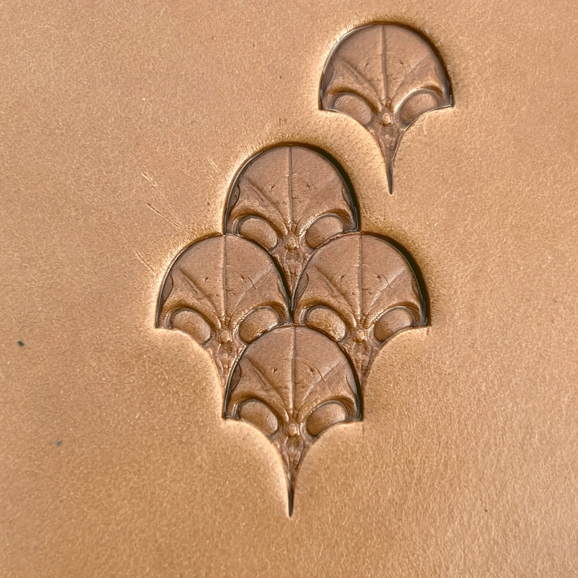 Alien Head leather stamp LT570 — pattern imprint on veg-tan leather