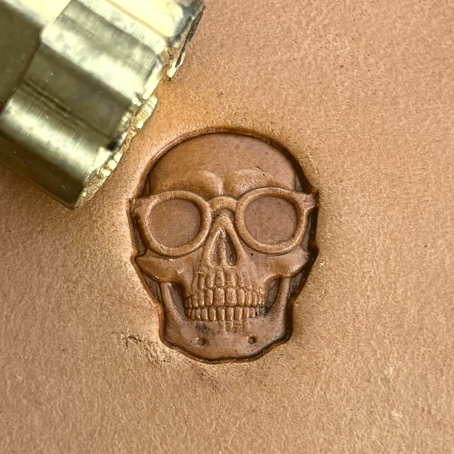 With Glasses Skull leather stamp LT576 — brass stamping tool with imprint on natural veg-tan leather