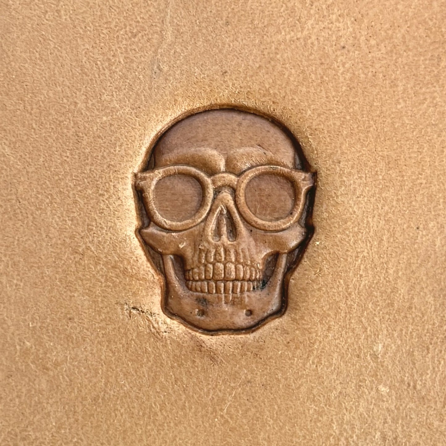 With Glasses Skull leather stamp LT576 — single impression on veg-tan leather