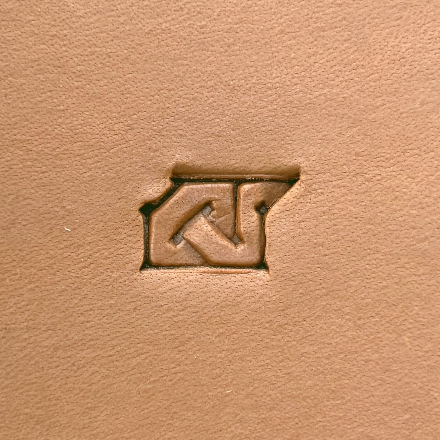Interlock Geometric leather stamp LT593 — single impression on veg-tan leather