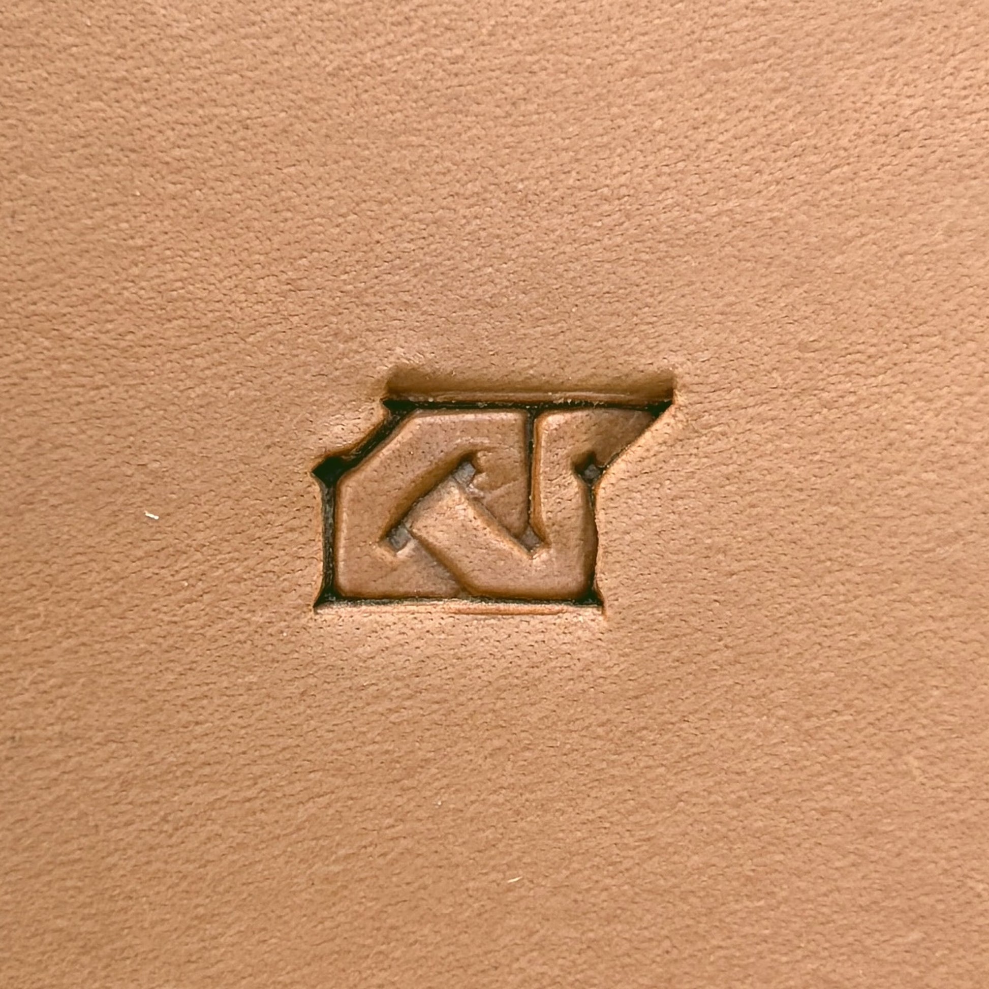 Interlock Geometric leather stamp LT593 — single impression on veg-tan leather