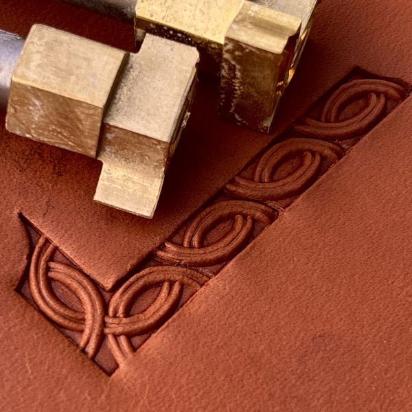 Interlaced Geometric leather stamp LT597 — brass stamping tool with imprint on natural veg-tan leather
