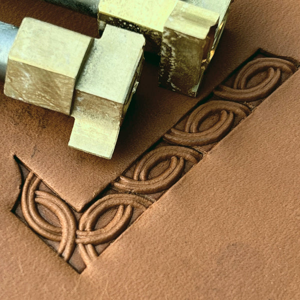 Interlaced Geometric leather stamp LT597 — brass stamping tool with imprint on natural veg-tan leather