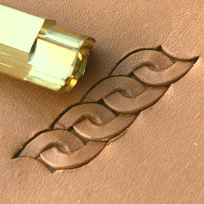 Interlocking Loop leather stamp LT601 — brass stamping tool with imprint on natural veg-tan leather