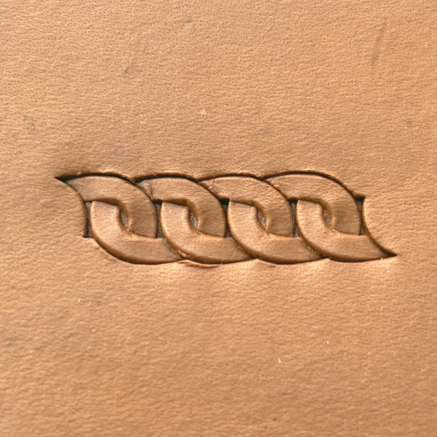 Interlocking Loop leather stamp LT601 — pattern imprint on veg-tan leather