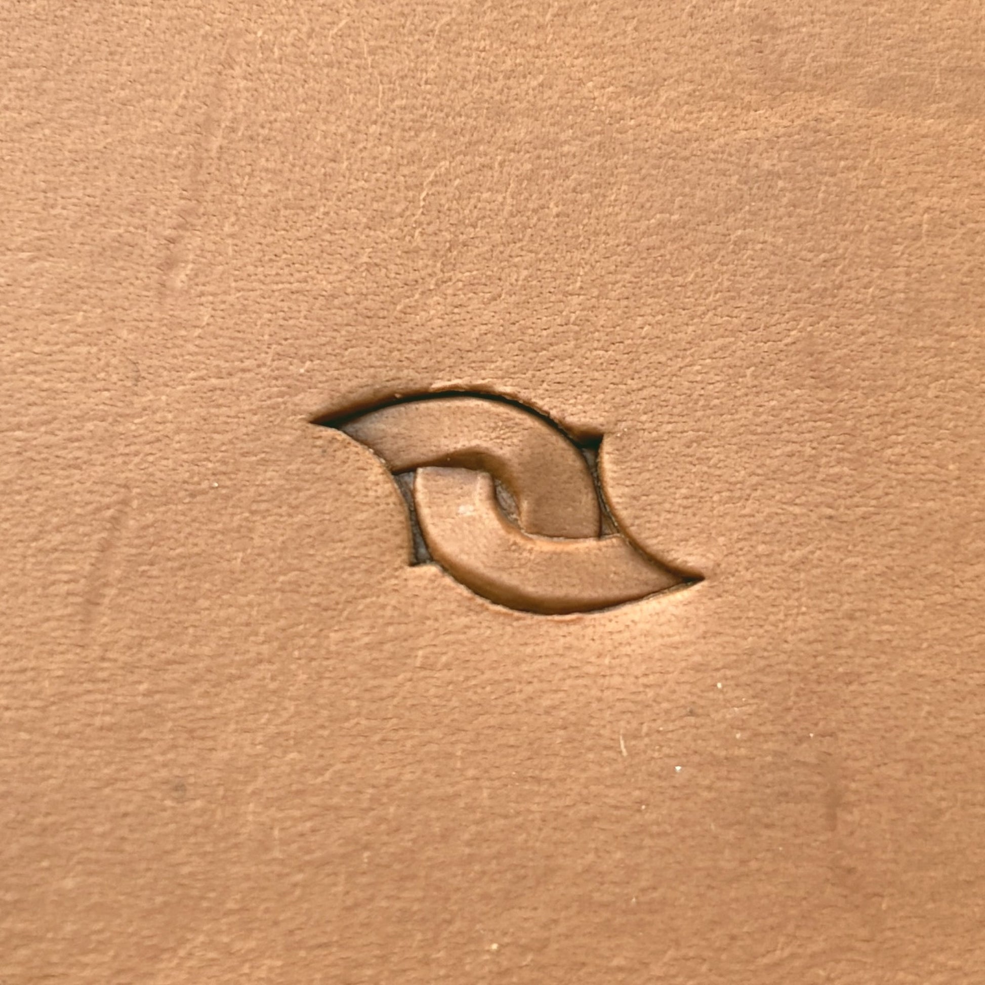 Interlocking Loop leather stamp LT601 — single impression on veg-tan leather