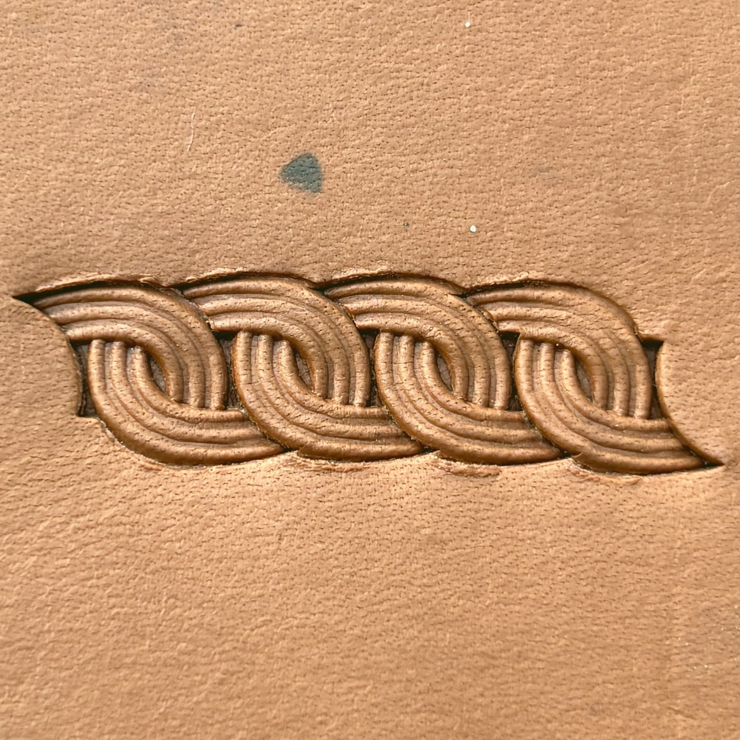 Interlock Basket Weave leather stamp LT602 — pattern imprint on veg-tan leather