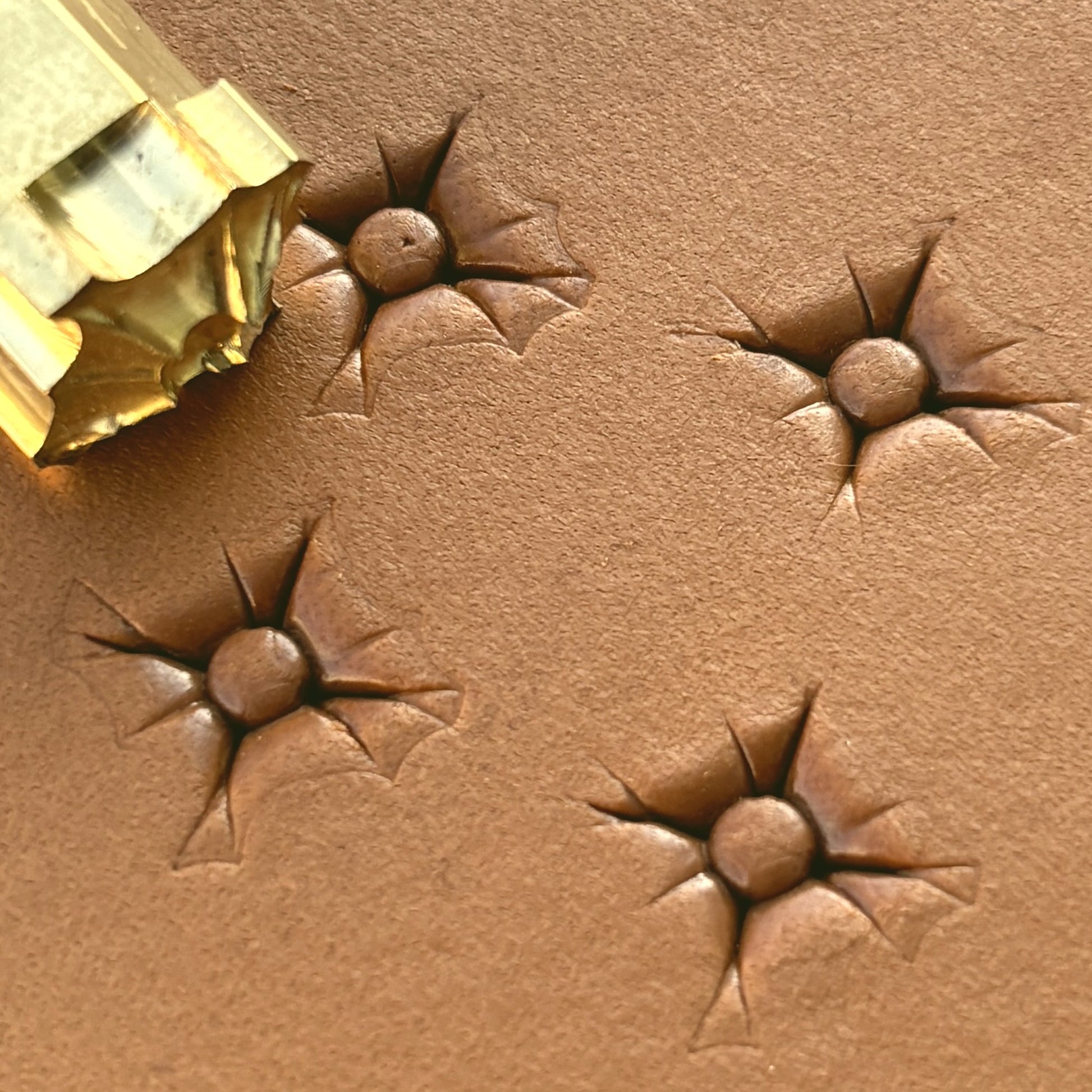 Starburst Geometric leather stamp LT608 — brass stamping tool with imprint on natural veg-tan leather