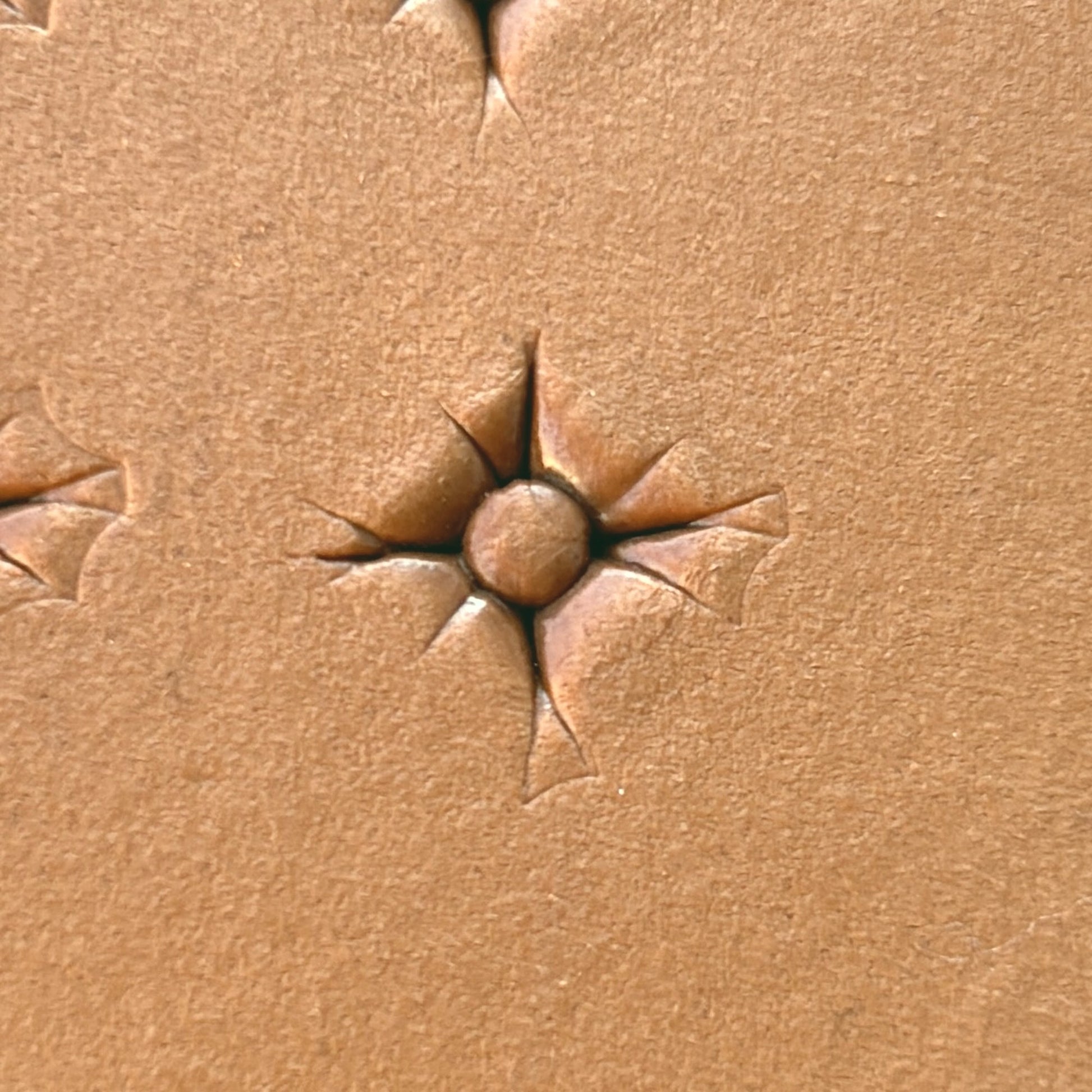 Starburst Geometric leather stamp LT608 — single impression on veg-tan leather