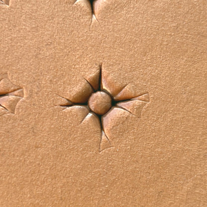 Starburst Geometric leather stamp LT608 — single impression on veg-tan leather