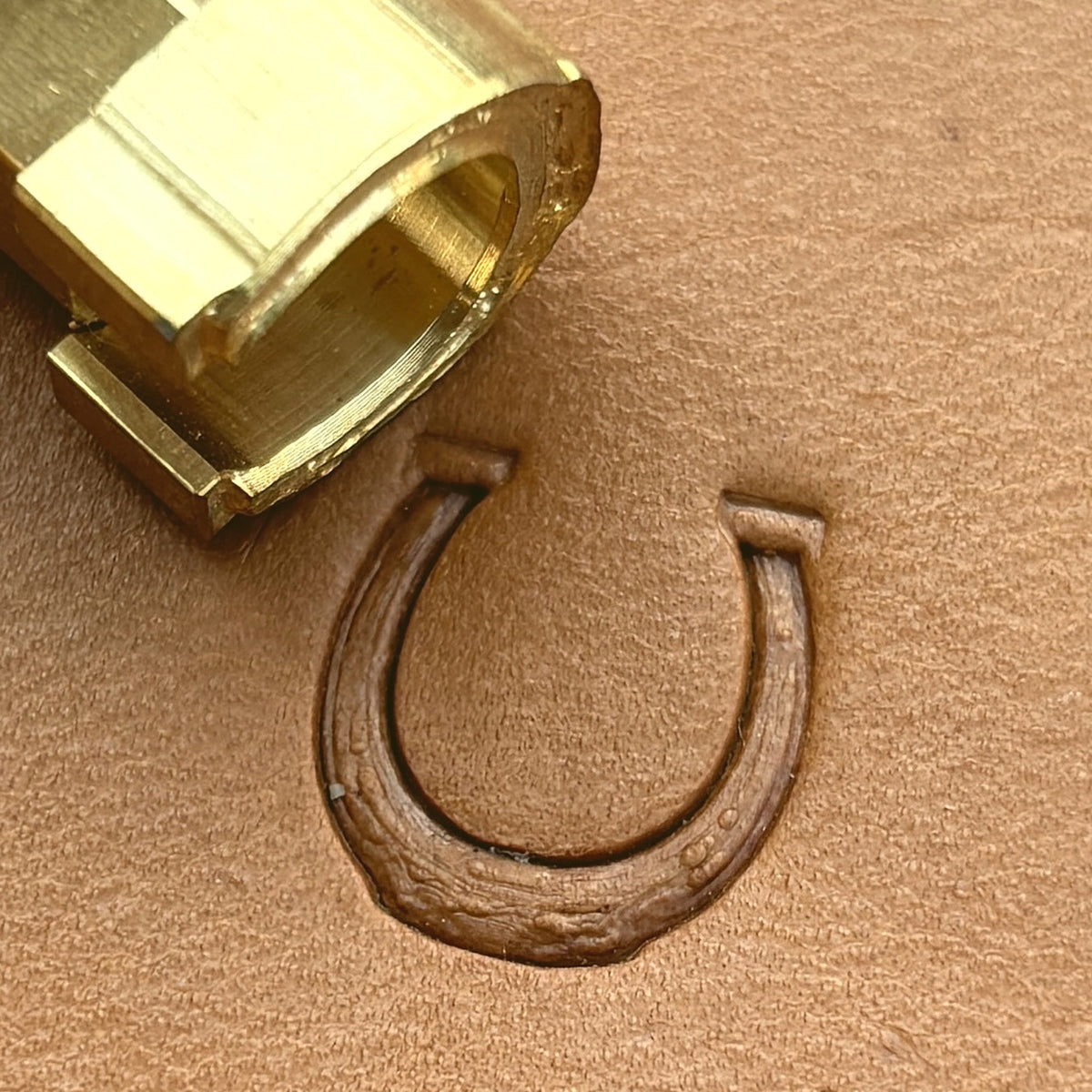 Horseshoe leather stamp LT614 — brass stamping tool with imprint on natural veg-tan leather