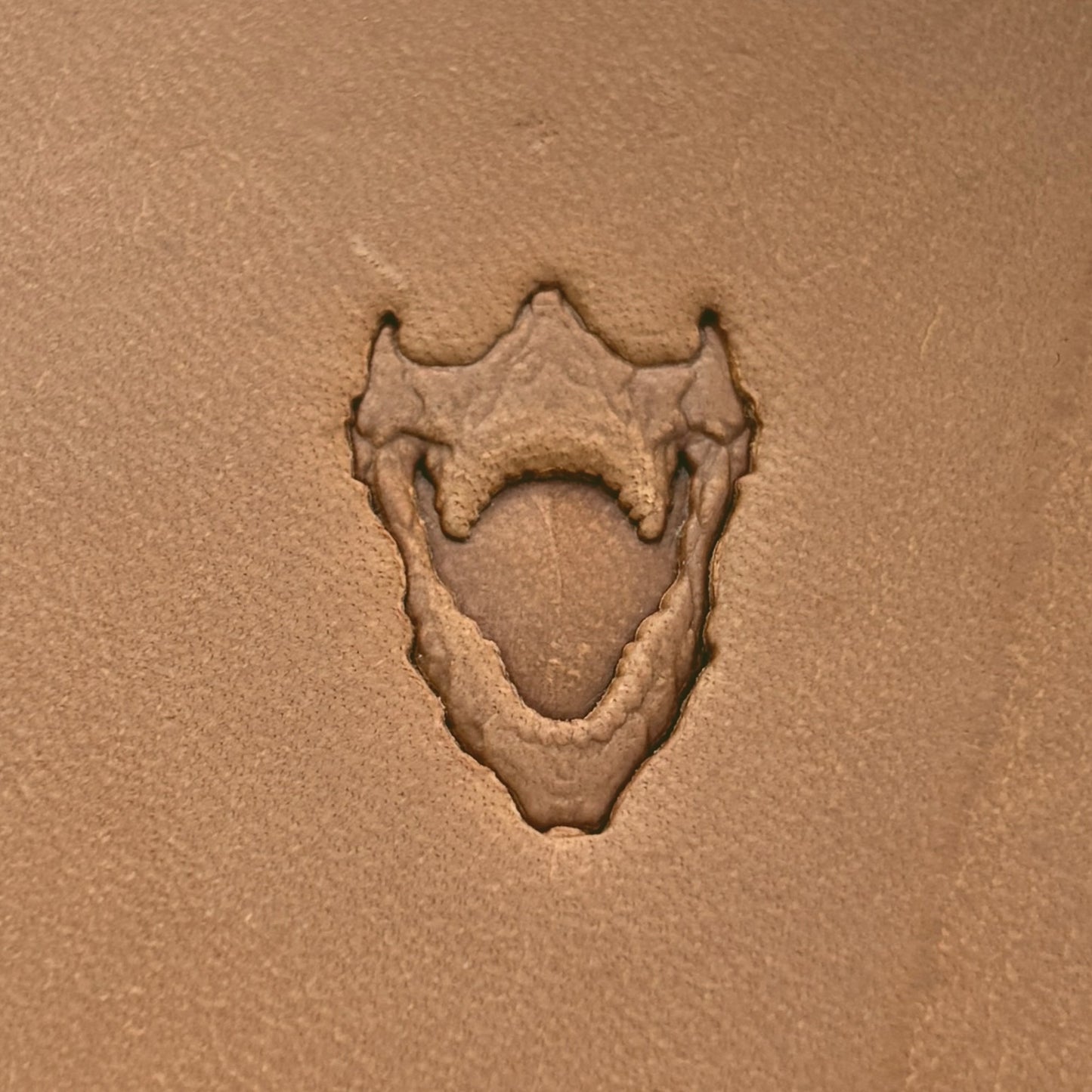 Open Jaws Skull leather stamp LT615 — pattern imprint on veg-tan leather