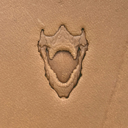 Open Jaws Skull leather stamp LT615 — single impression on veg-tan leather