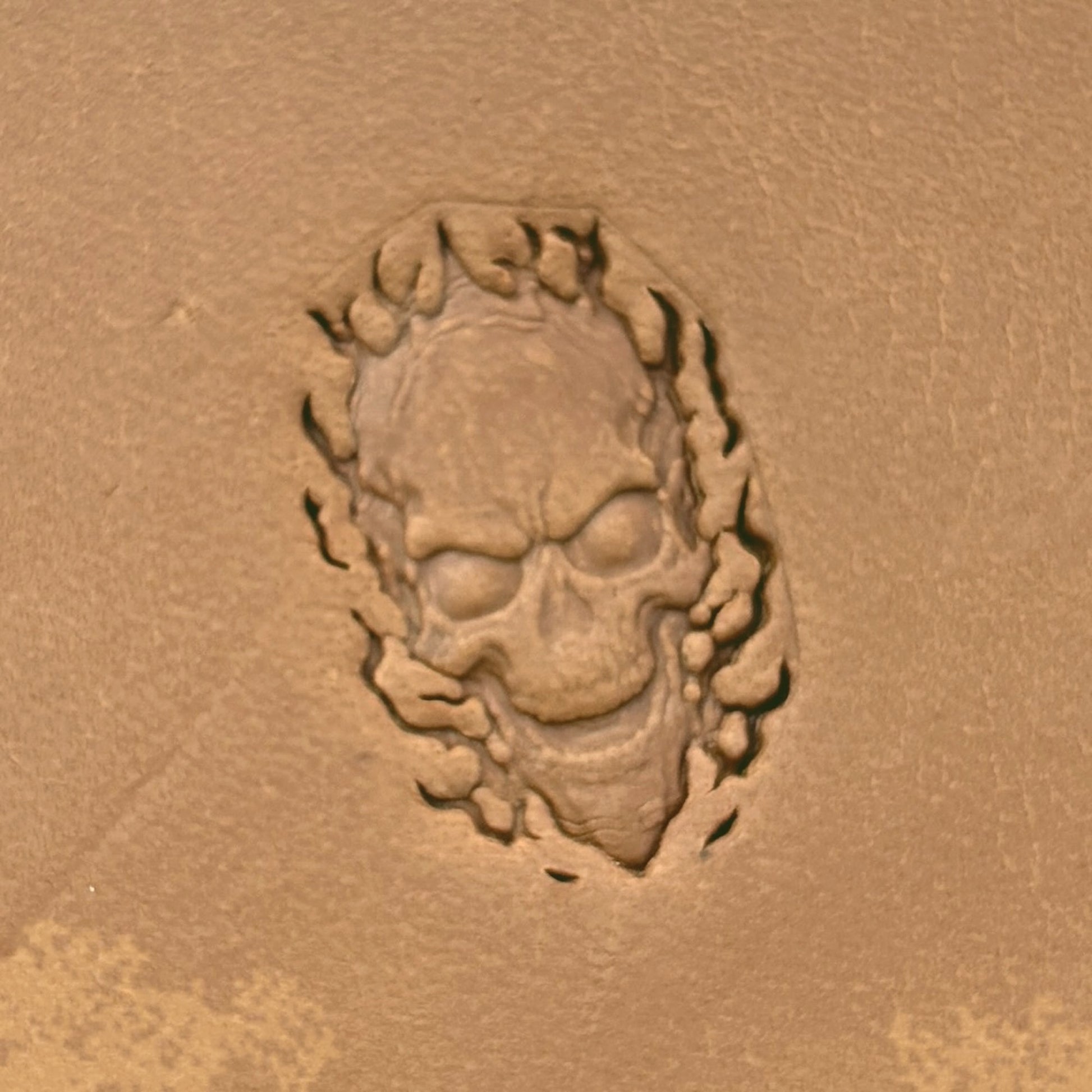 Flaming Skull leather stamp LT618 — single impression on veg-tan leather
