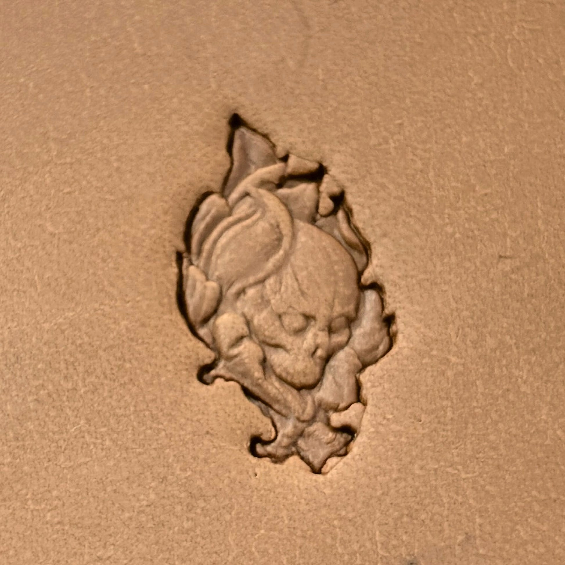 Leaf Shape Skull leather stamp LT622 — single impression on veg-tan leather