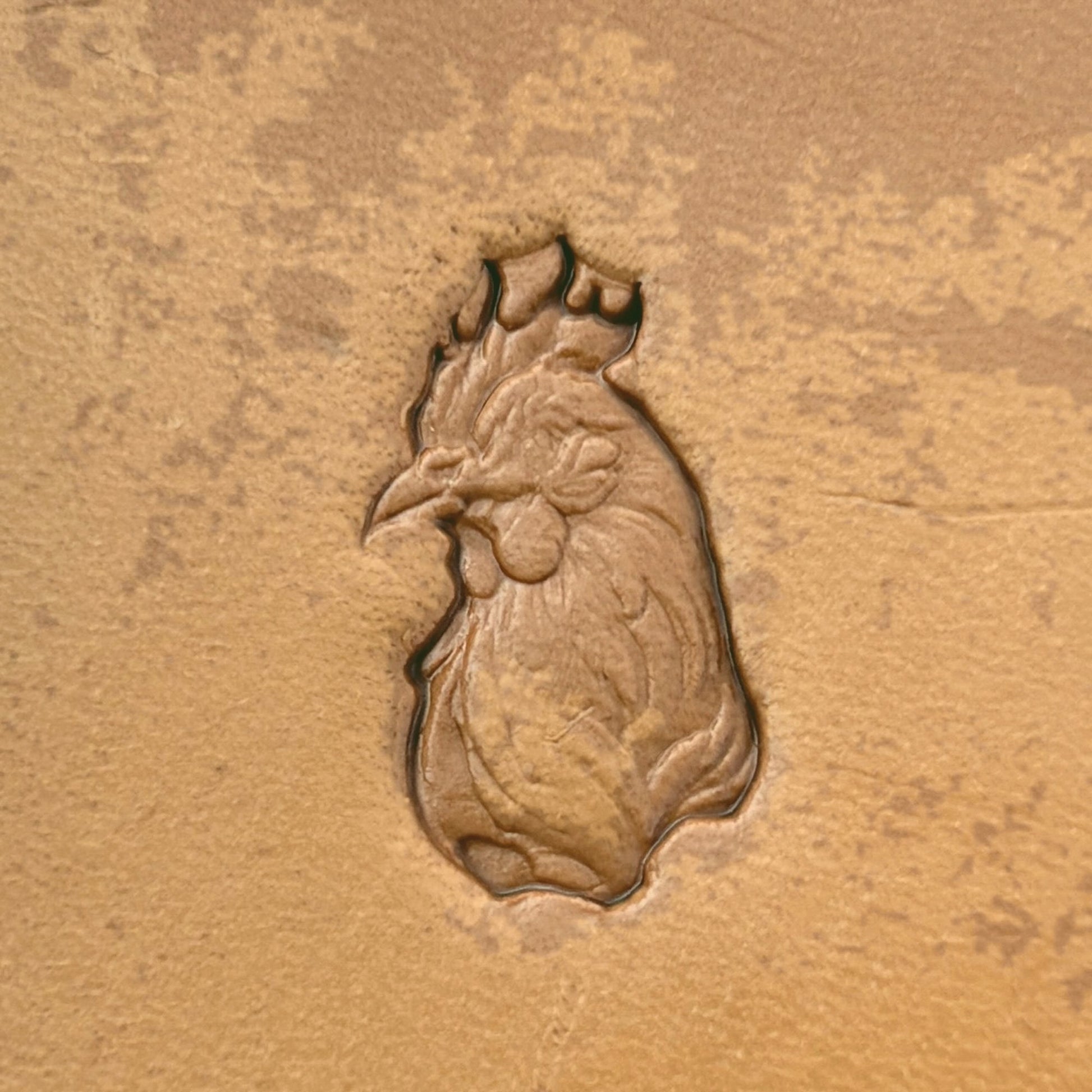 Rooster Head Animal leather stamp LT623 — single impression on veg-tan leather