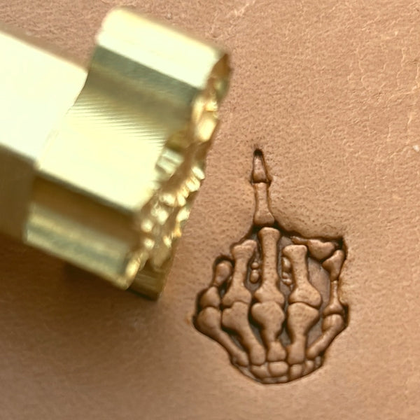Middle Finger Skeleton Hand leather stamp LT634 — brass stamping tool with imprint on natural veg-tan leather
