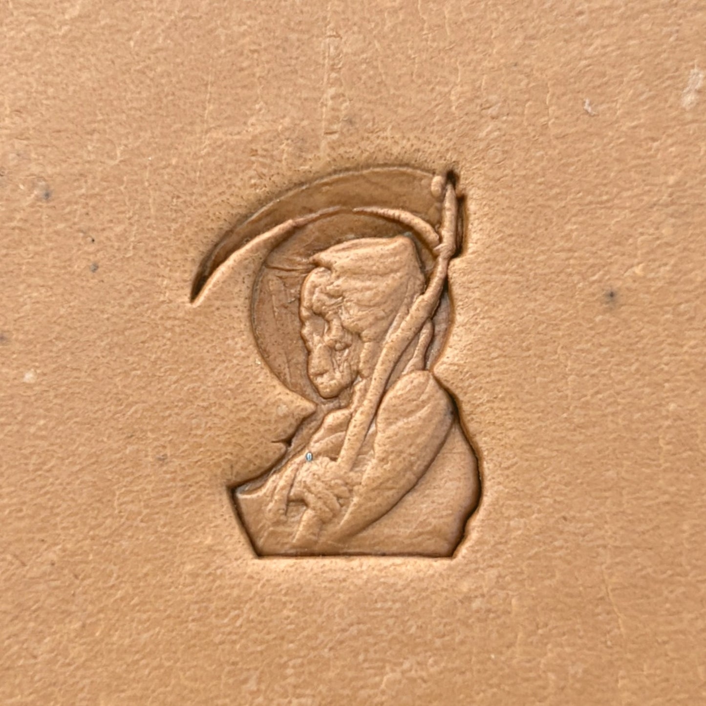 Grim Reaper Skull leather stamp LT635 — single impression on veg-tan leather
