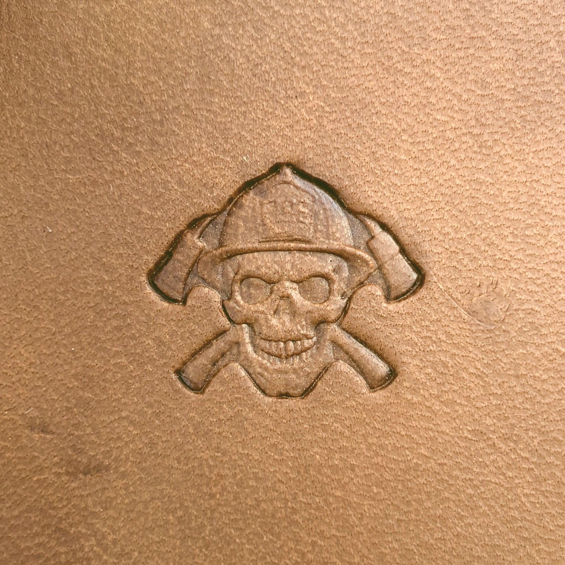 Firefighter Skull leather stamp LT638 — single impression on veg-tan leather