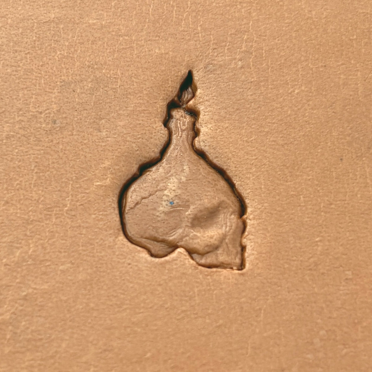 Candle Skull leather stamp LT639 — single impression on veg-tan leather