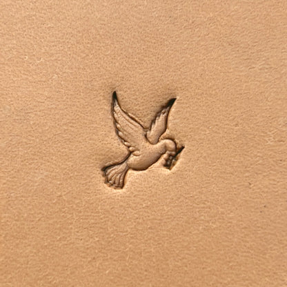 Flying Dove leather stamp LT643 — single impression on veg-tan leather