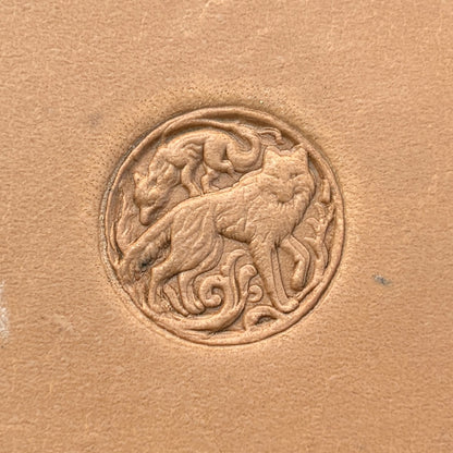 Twin Wolves Circle leather stamp LT645 — single impression on veg-tan leather