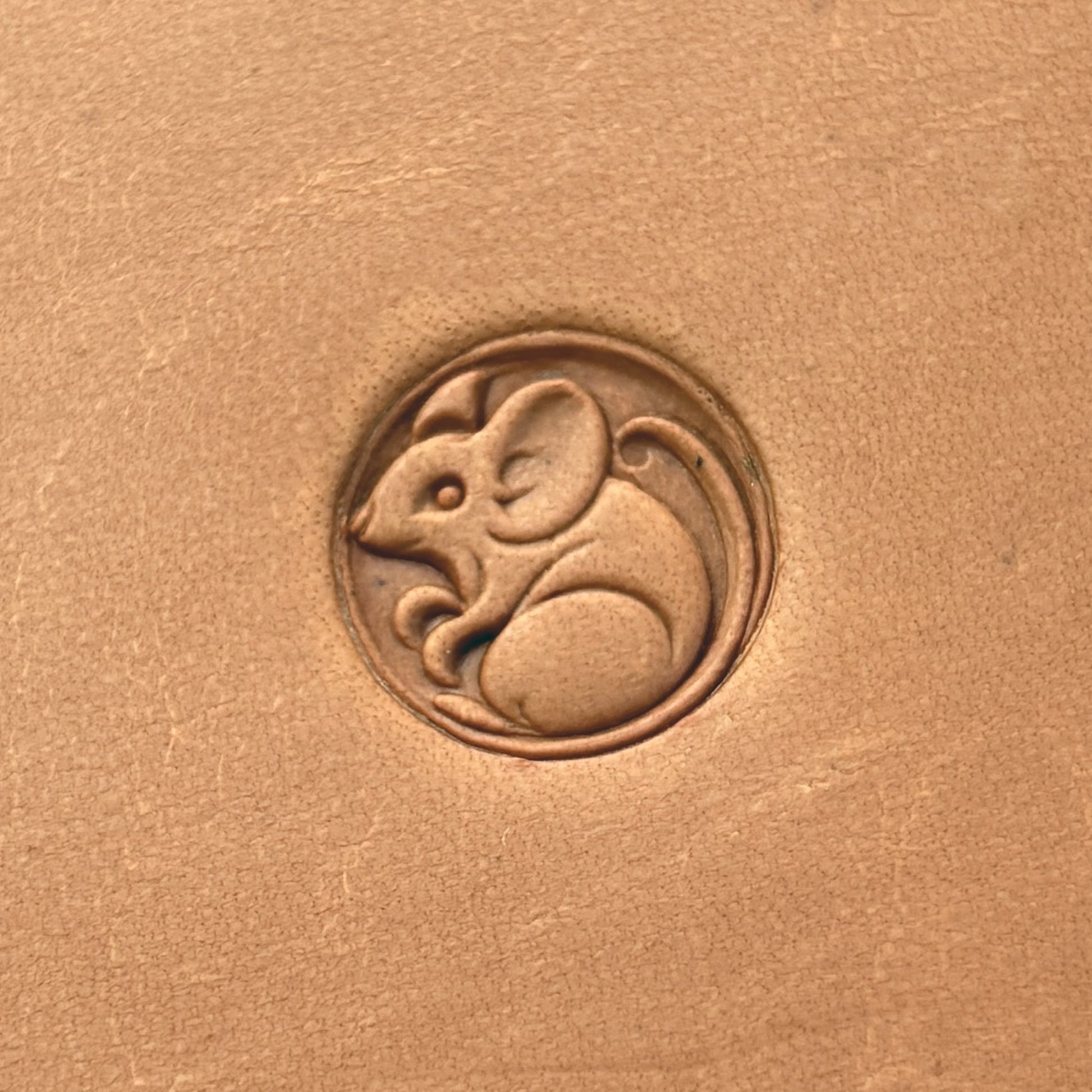 Mouse in Circle leather stamp LT658 — single impression on veg-tan leather