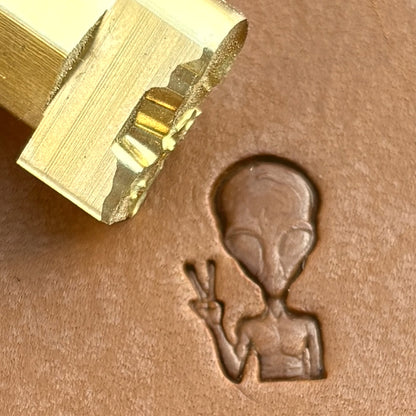 Peace Alien leather stamp LT676 — brass stamping tool with imprint on natural veg-tan leather