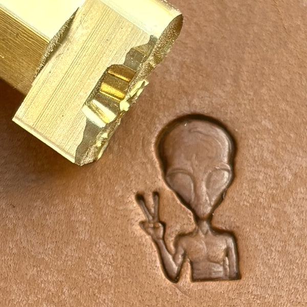 Peace Alien leather stamp LT676 — brass stamping tool with imprint on natural veg-tan leather