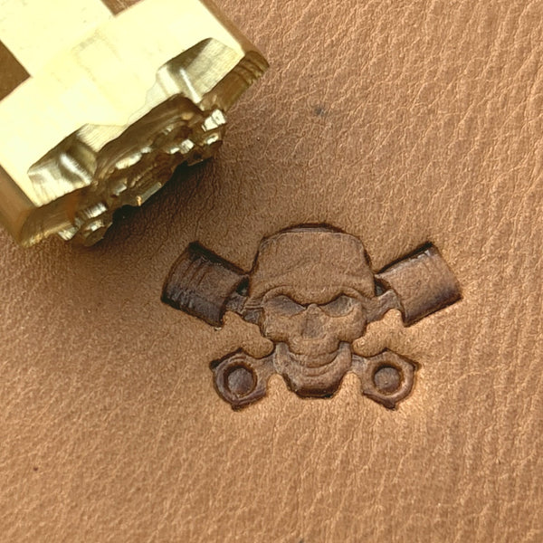 Piston Crossbones Skull leather stamp LT692 — brass stamping tool with imprint on natural veg-tan leather