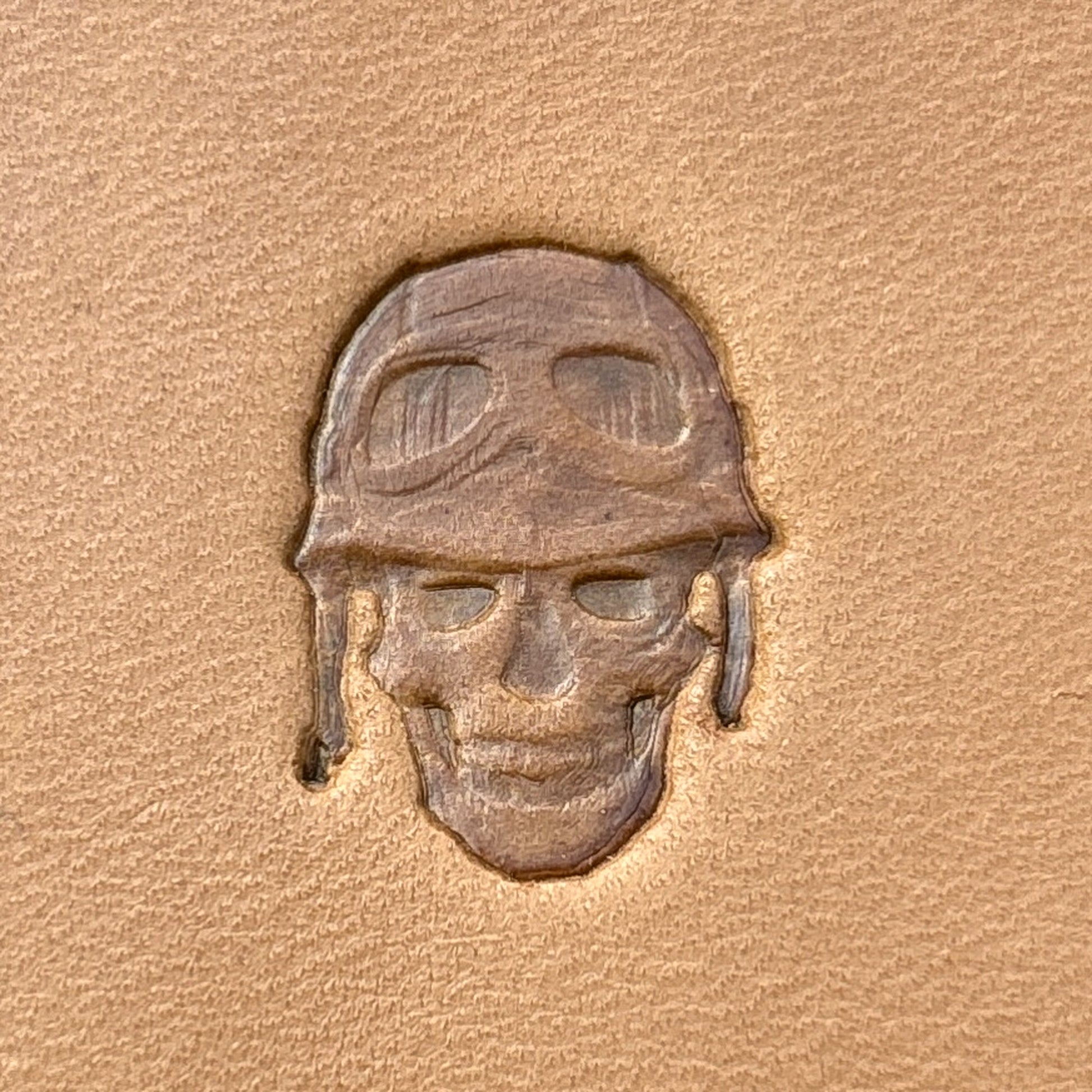 Aviator Helmet Skull leather stamp LT695 — single impression on veg-tan leather