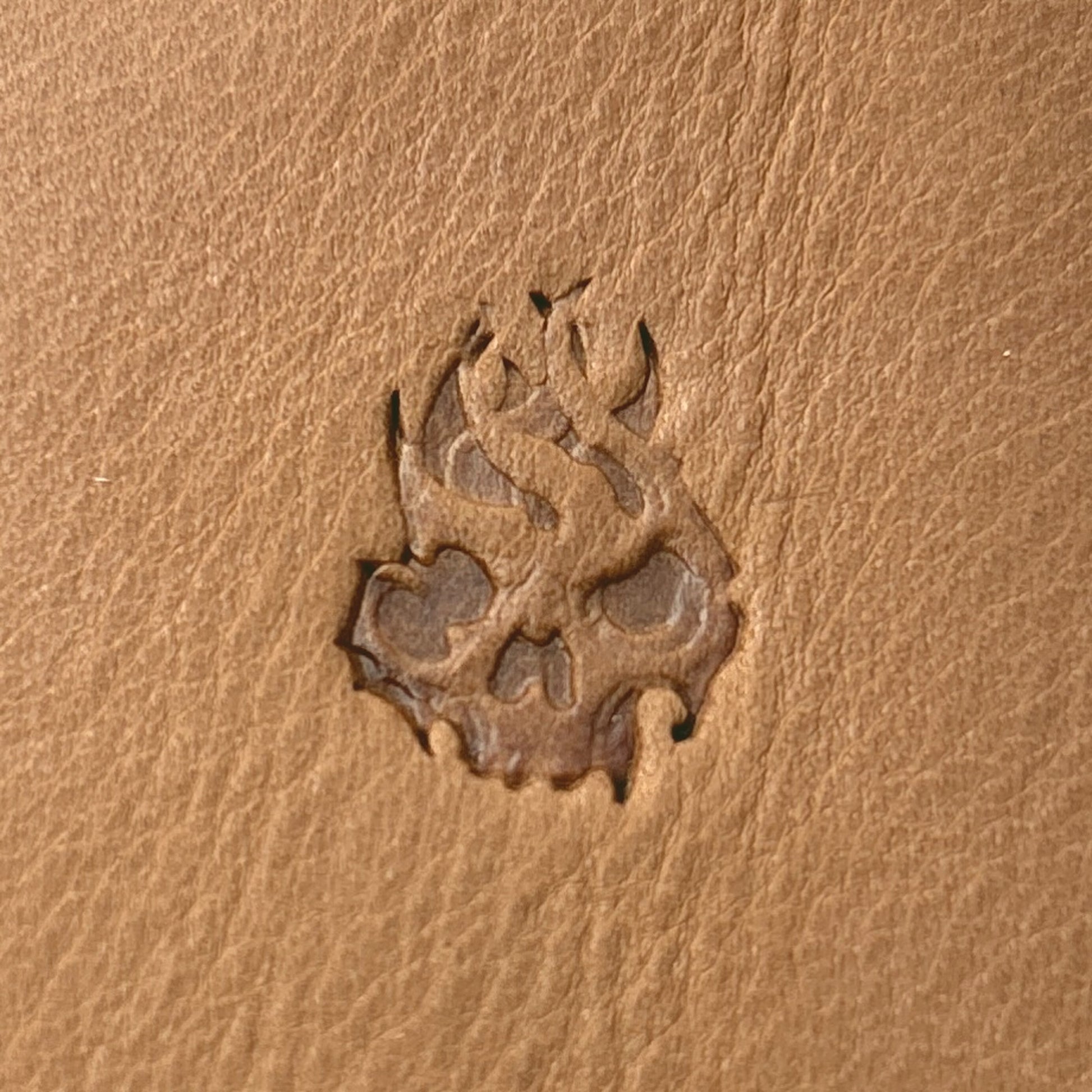Flaming Skull leather stamp LT703 — single impression on veg-tan leather