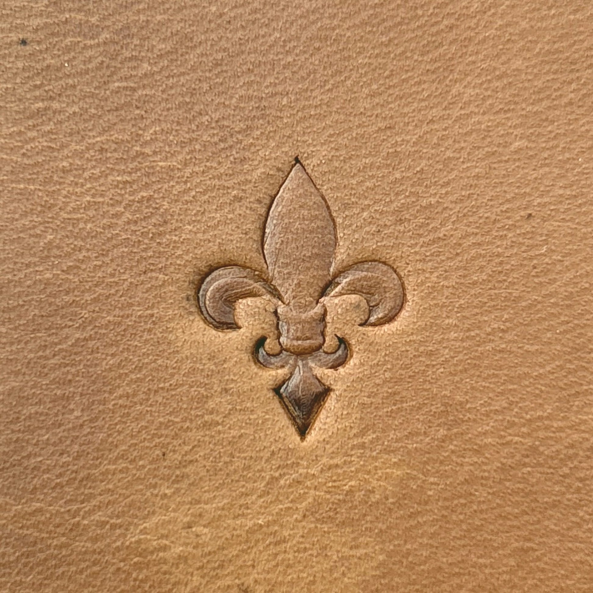 Fleur leather stamp LT704 — single impression on veg-tan leather