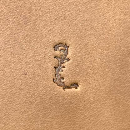 Ornate Initial Flower leather stamp LT711 — single impression on veg-tan leather