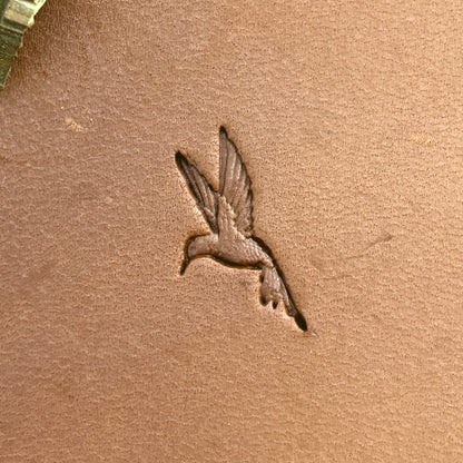 Hummingbird leather stamp LT717 — single impression on veg-tan leather
