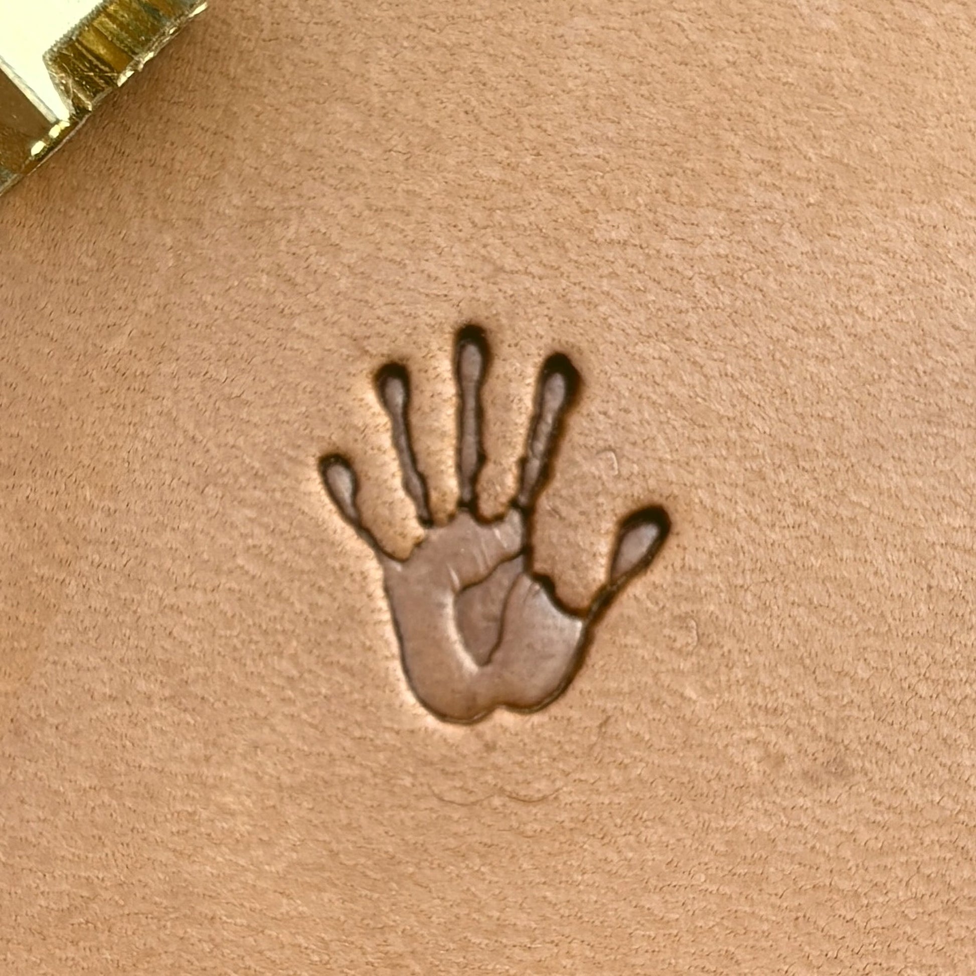 Handprint leather stamp LT718 — single impression on veg-tan leather