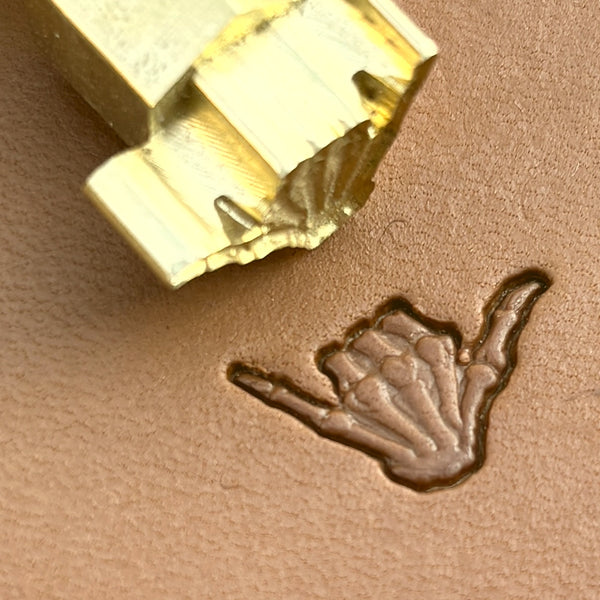 Shaka Hand Skull leather stamp LT719 — brass stamping tool with imprint on natural veg-tan leather