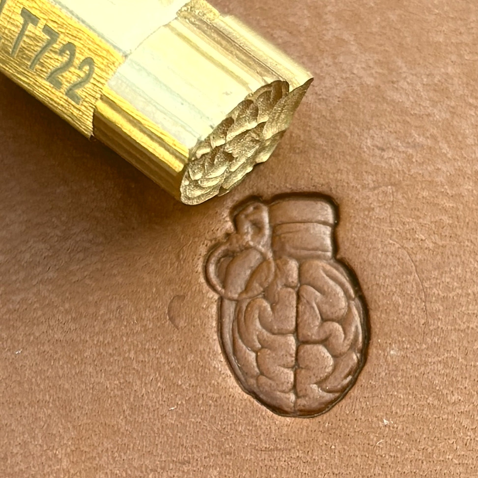 Brain Grenade leather stamp LT722 — brass stamping tool with imprint on natural veg-tan leather