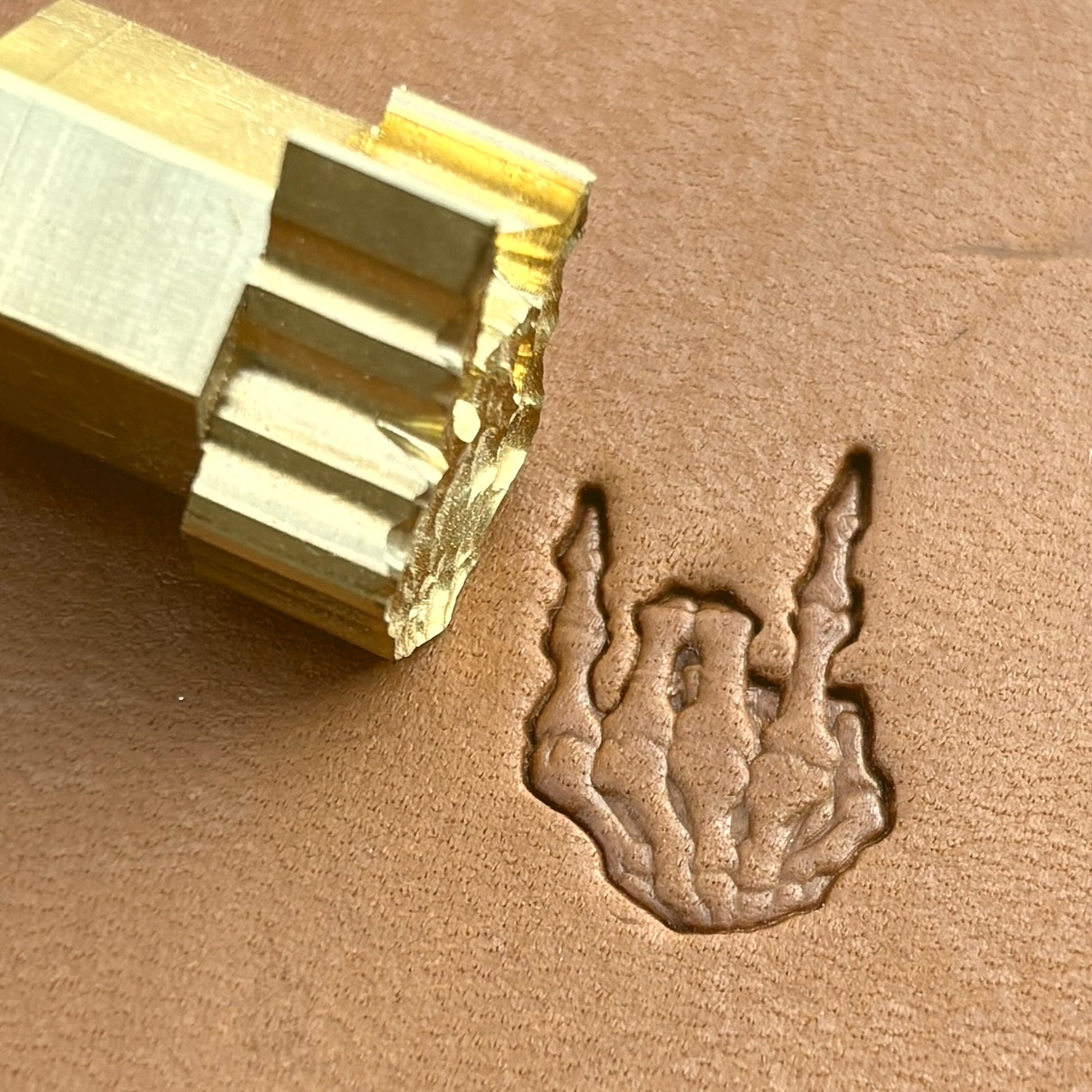 Devil Horns Hand Skull leather stamp LT723 — brass stamping tool with imprint on natural veg-tan leather