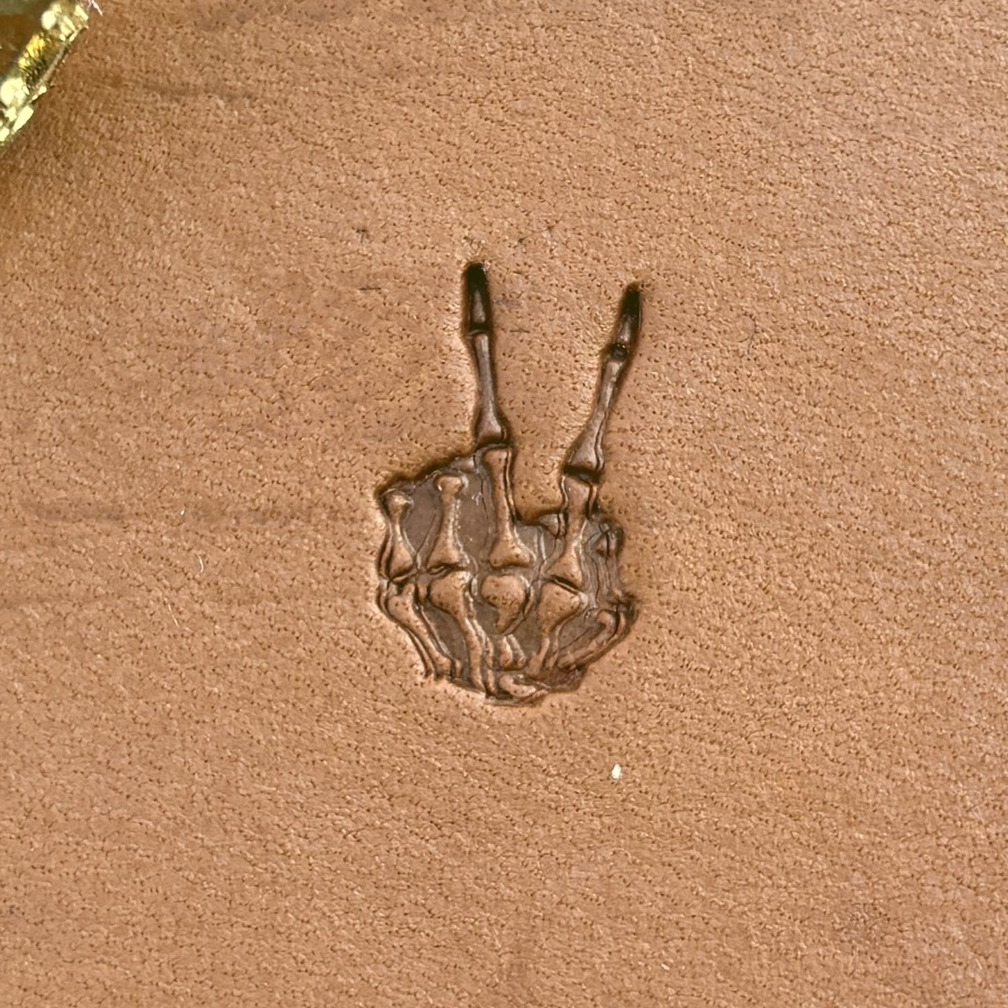 Peace Sign Skeleton Hand leather stamp LT725 — single impression on veg-tan leather