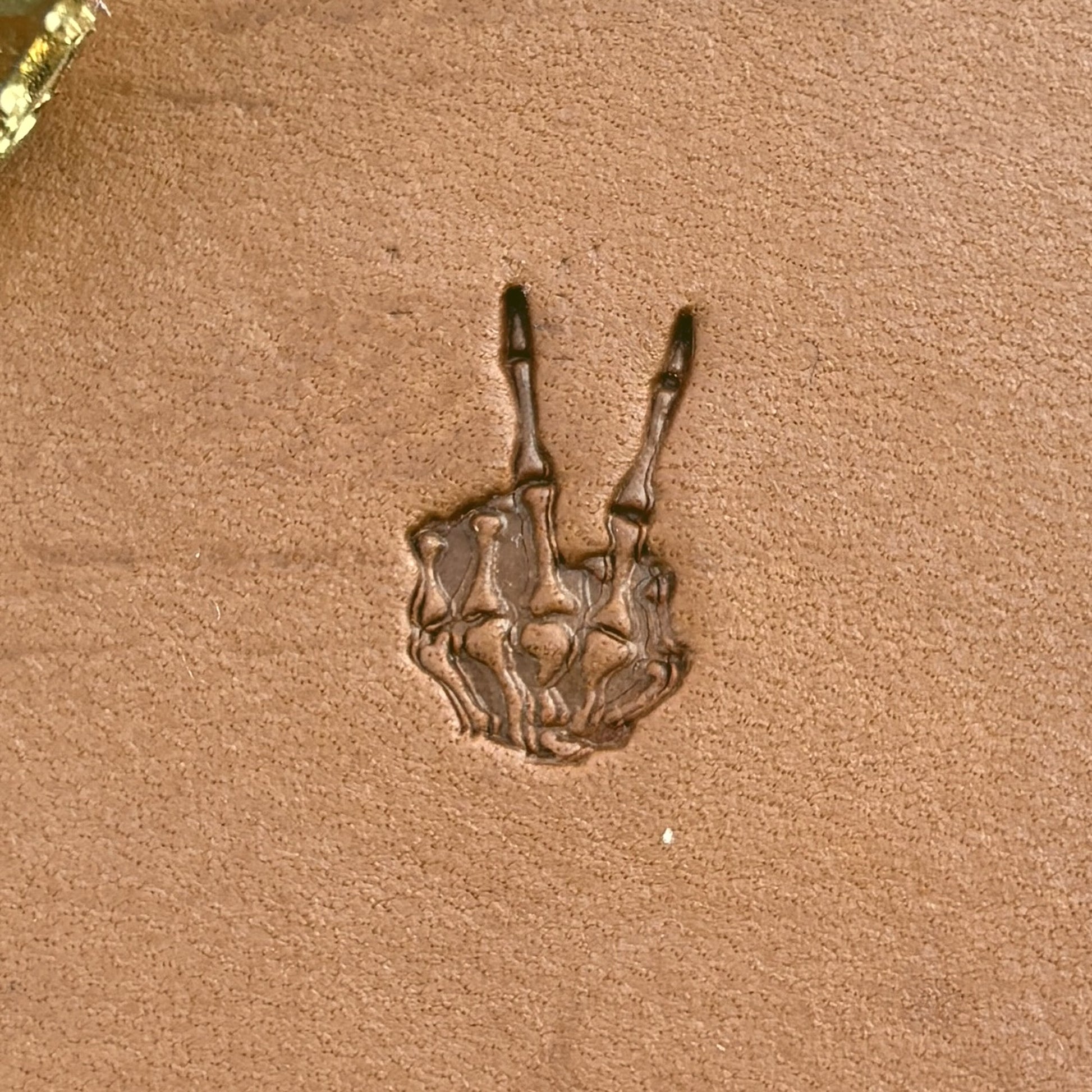 Peace Sign Skeleton Hand leather stamp LT725 — single impression on veg-tan leather