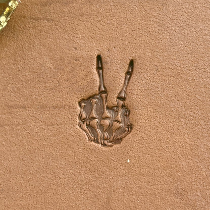 Peace Sign Skeleton Hand leather stamp LT725 — single impression on veg-tan leather