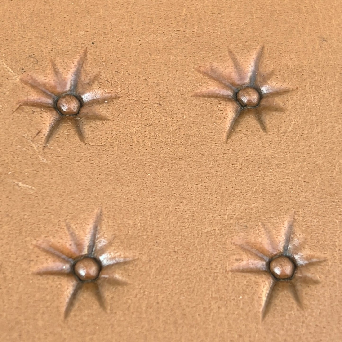 Starburst leather stamp LT743 — pattern imprint on veg-tan leather
