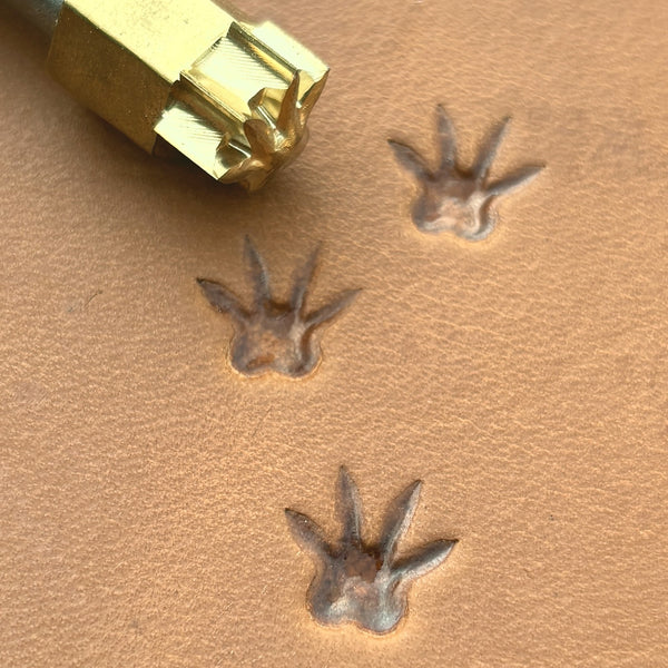 Rat Tracks leather stamp LT746 — brass stamping tool with imprint on natural veg-tan leather
