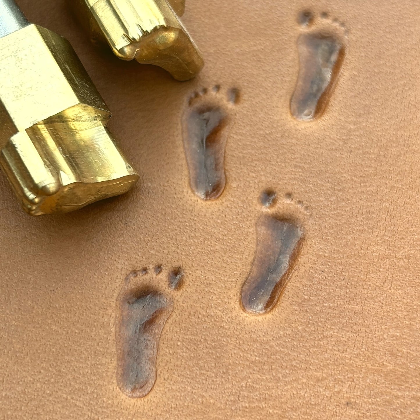 Bare Footprint leather stamp LT748 — brass stamping tool with imprint on natural veg-tan leather