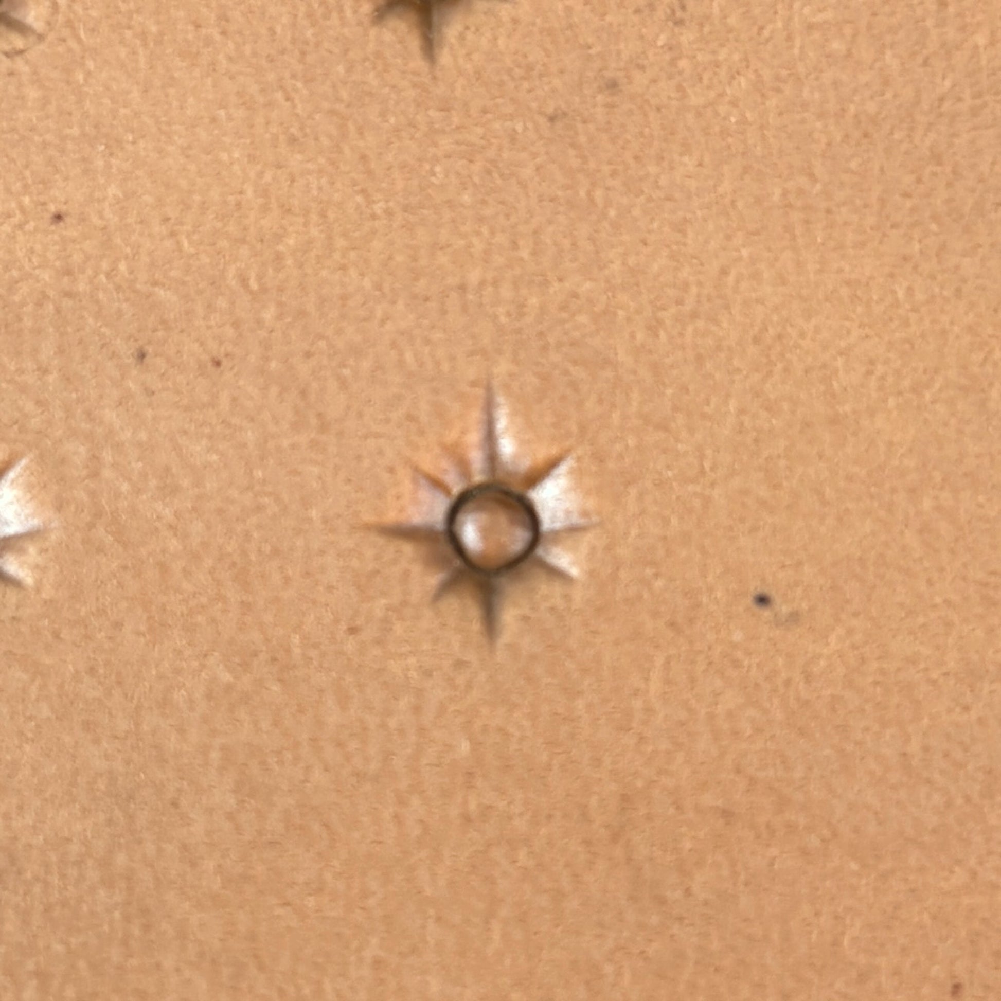 Starburst Geometric leather stamp LT749 — single impression on veg-tan leather